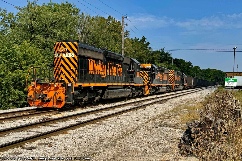 WE 7015 & Co. are in Rock Cut Siding with the train they brought to town.